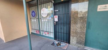 Entrance to a family pediatrician clinic with a doormat.