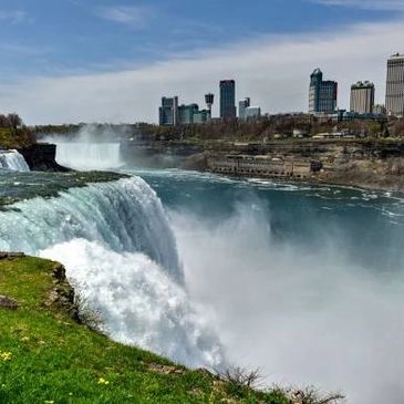 Niagara Falls cascading powerfully with torrents of water plunging over the edge,