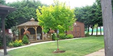 A lovely landscaped yard and gazebo bekons you to relax and enjoy our peaceful outdoors.