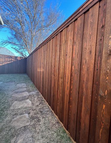 Newly installed pre-stained cedar board-on-board privacy fence built by NTX Fence & Outdoor Living i