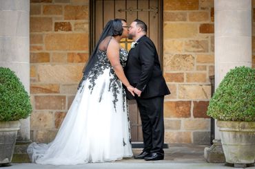 Husband and Wife kissing after wedding in a portrait in Downtown Spartanburg South Carolina