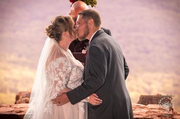 Husband and Wife sharing first kiss during wedding at Pretty Place Chapel in Greenville SC