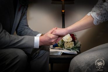 Husband & Wife holding hands praying together during wedding in Inman South Carolina