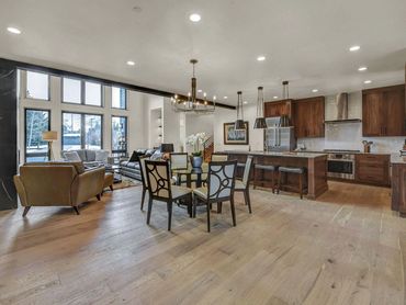 Kitchen counter flooring tile back splash appliances lighting cabinets molding wood LVP granite tile