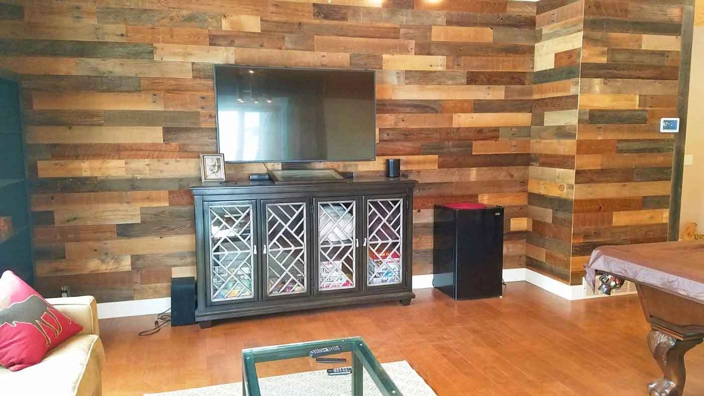 A Reclaimed barn wood custom designed wall in the Living room. Remodel Carpentry Plumbing Electrical
