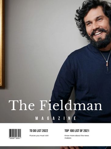 Smiling man on the cover of The Fieldman Magazine, featuring 2022 travel and 2021 newsmaker lists.