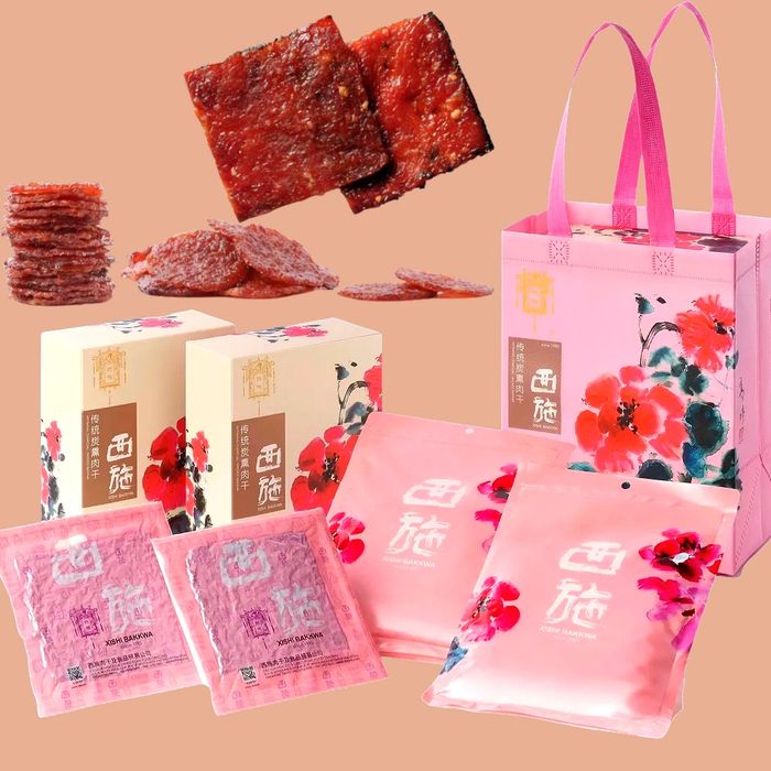 Assorted pink-packaged bakkwa snacks with floral designs and slices of meat.