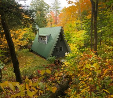 Vermont Chalet A-frame cabin in fall foliage in Jamaica Vermont
