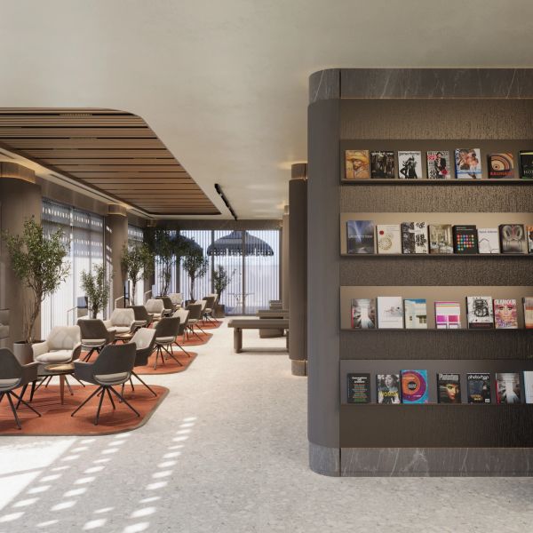 Modern ve şık bir bekleme alanı ve kitap rafları.