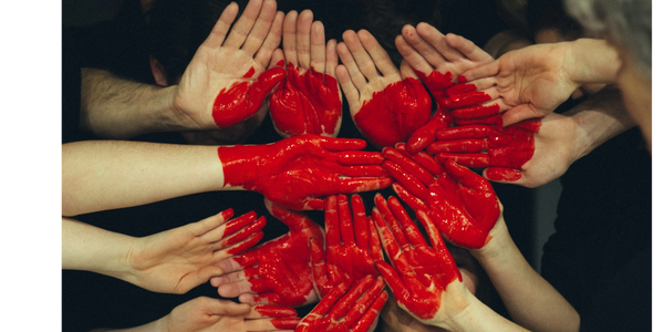 Painted hands forming the shape of a heart
