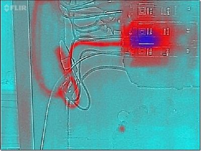 Photo shows a circuit breaker and wires in a breaker box that is hot (using a thermal camera)
