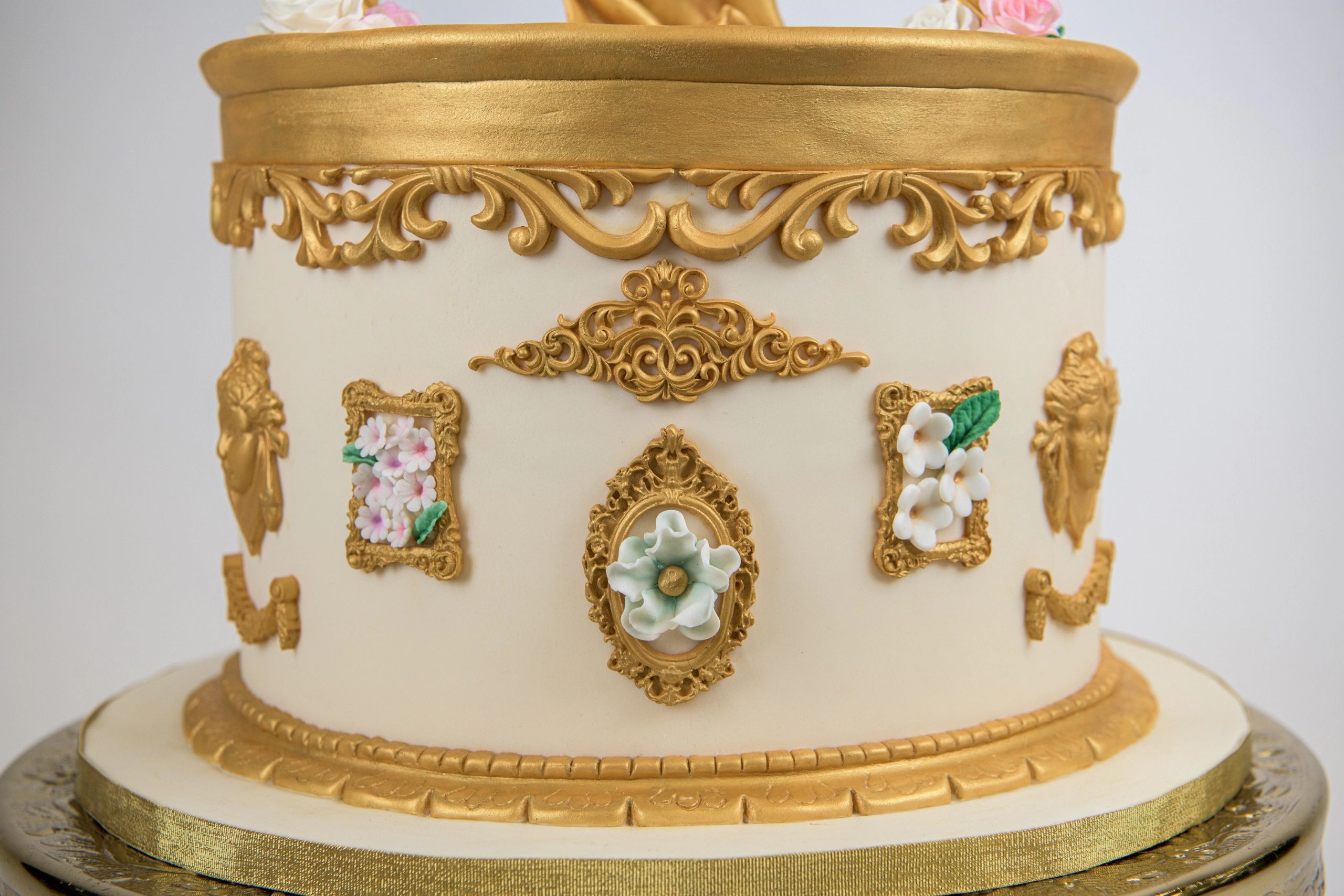 Bottom tier of a baby shower cake.