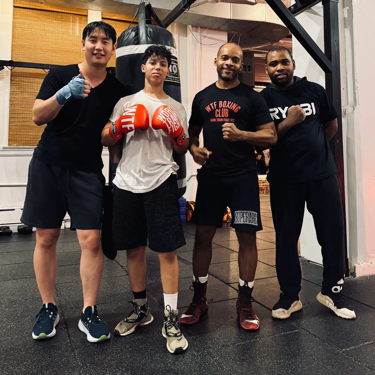 NYC Boxing Coach Ralph Gilmore teaching small group boxing at a Work Train Fight boxing gym in SoHo.