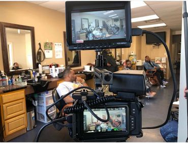 Barbershop scene. Actors and Camera man.