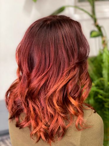 Red hair color. color transformation at minima hair beauty in NYC 