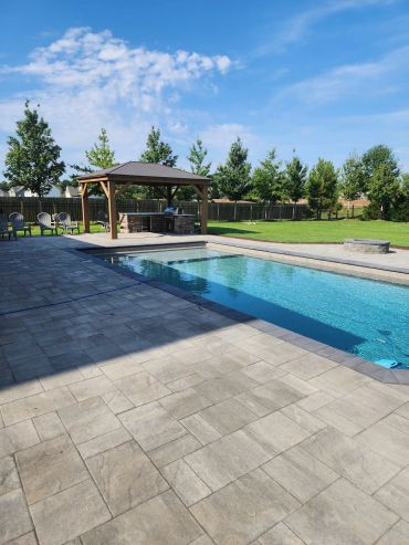 Paver Patio around Swimming Pool, Outdoor Kitchen, Pergola