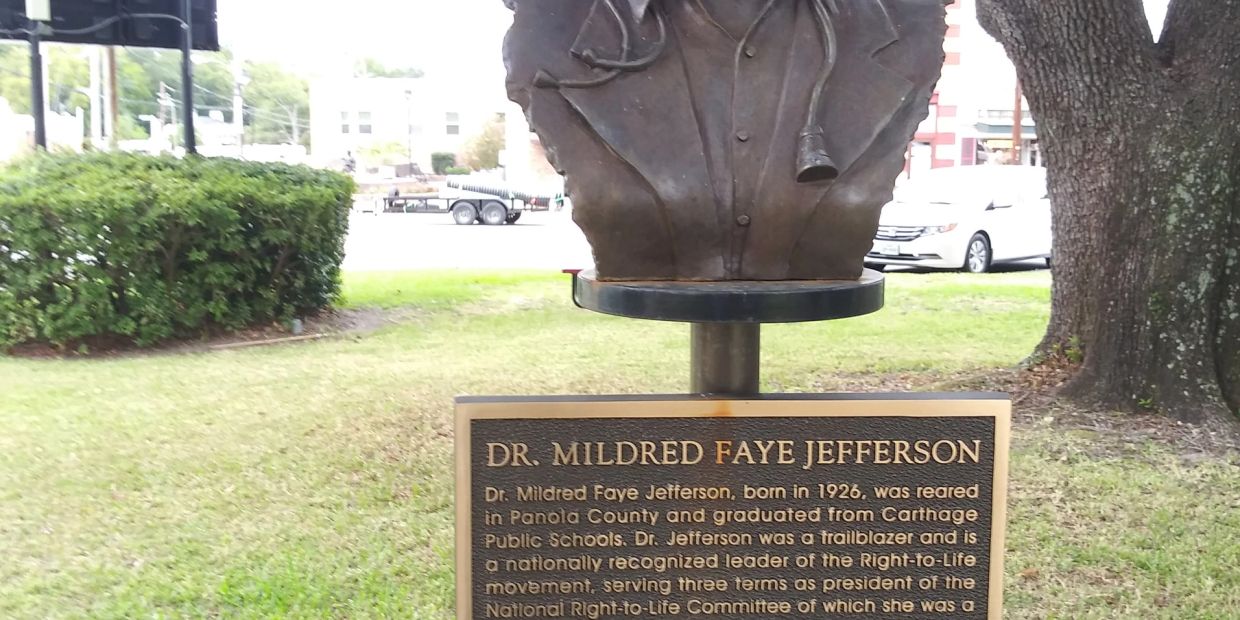 Bust and plaque honoring Dr. Mildred Faye Jefferson outdoors.