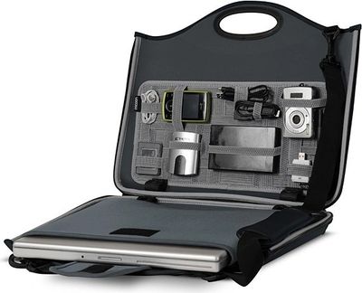 An open briefcase containing various private investigation electronic surveillance equipment.