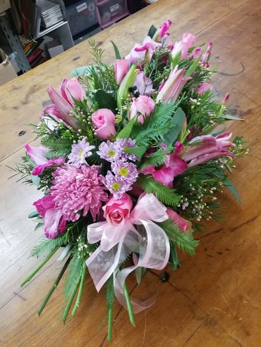 Pink funeral sheaf of flowers created by a qualified florist at The Florist Tree
