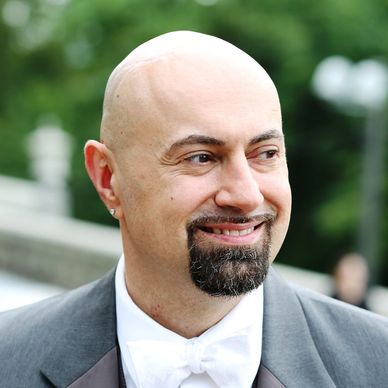 A bald man with facial hair