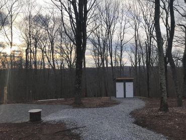 Non-flushable outhouse on site