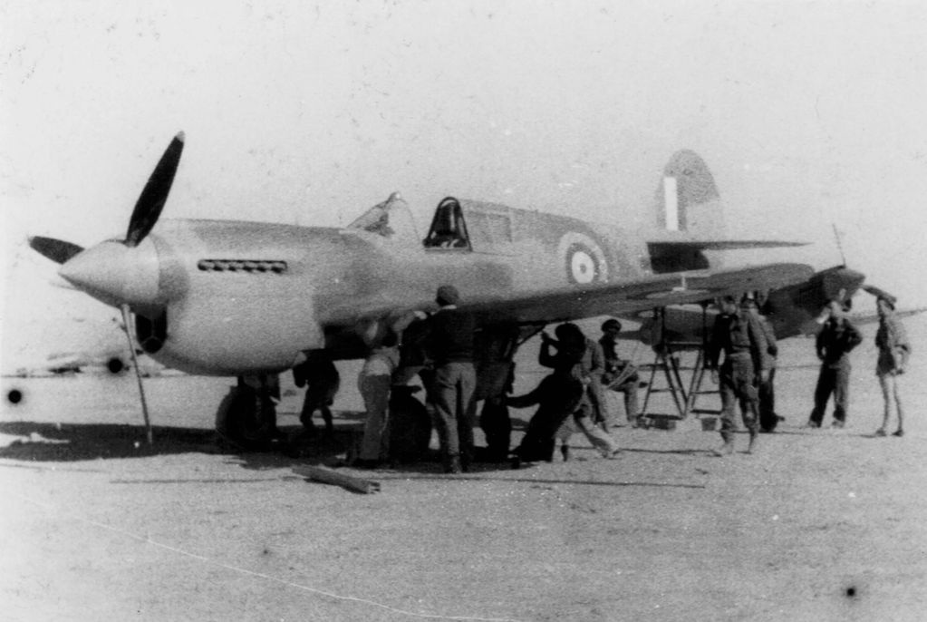 450 SQN Armament crew lifting for gun alignment on Kittyhawk-1942