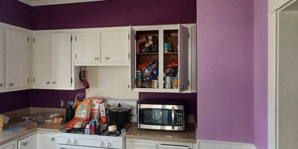 Purple and lavender kitchen with white cabinets