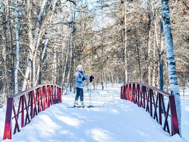 Snowy bridge with Kristi on skis