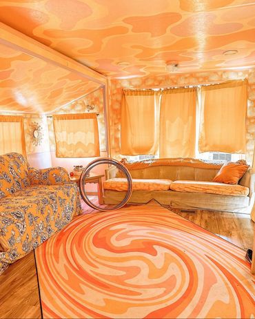 Fully custom renovated RV at a California desert resort. Themed and colored to match the sunrises.