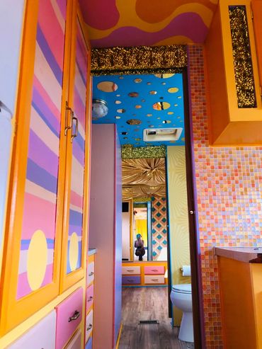 Fully custom renovated RV at a California desert resort. Themed and colored to match the sunrises.