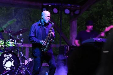 Chuck "CC" Cave on stage.