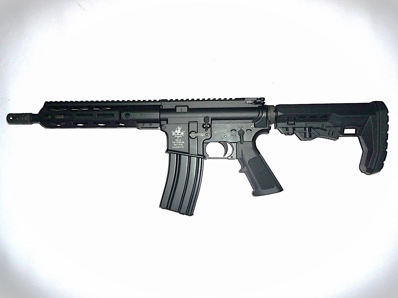 Black semi-automatic AR-15 rifle with a tactical stock and extended magazine.
