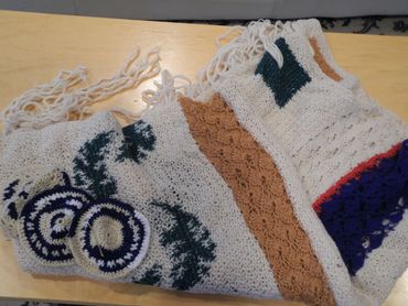 Crocheted tallit and kippot. Wool and silk yarns.