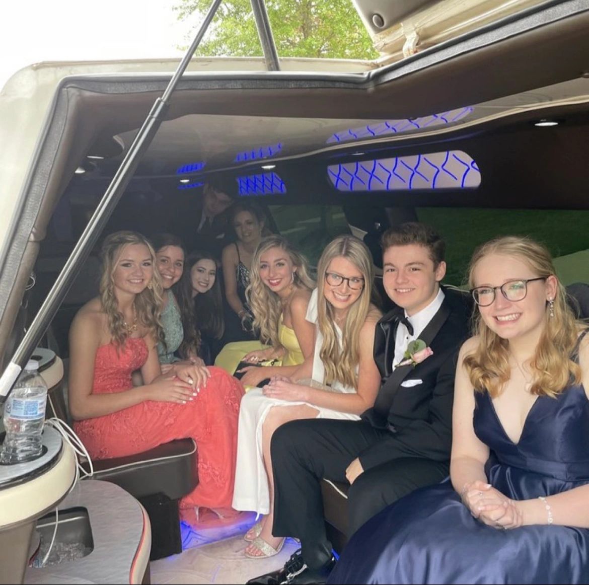 homecoming kids riding in limo