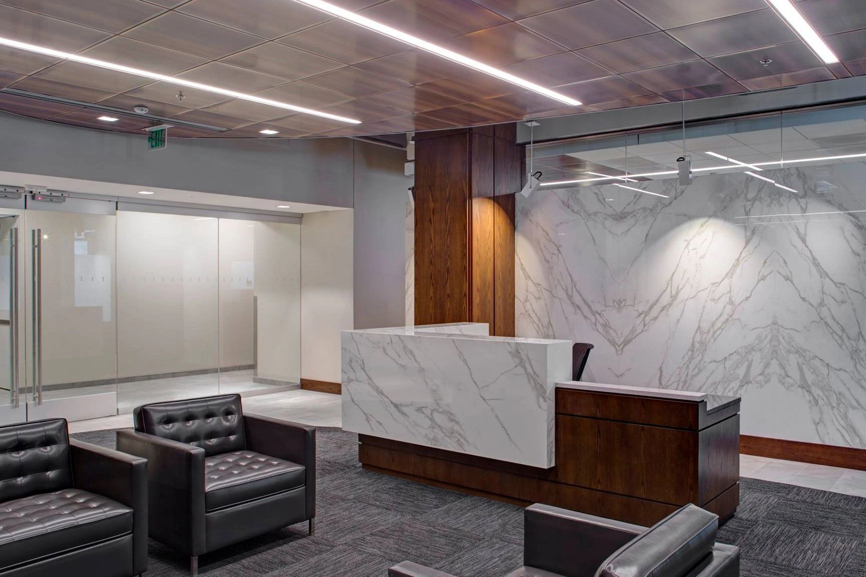 Lobby with large marble desk and wall