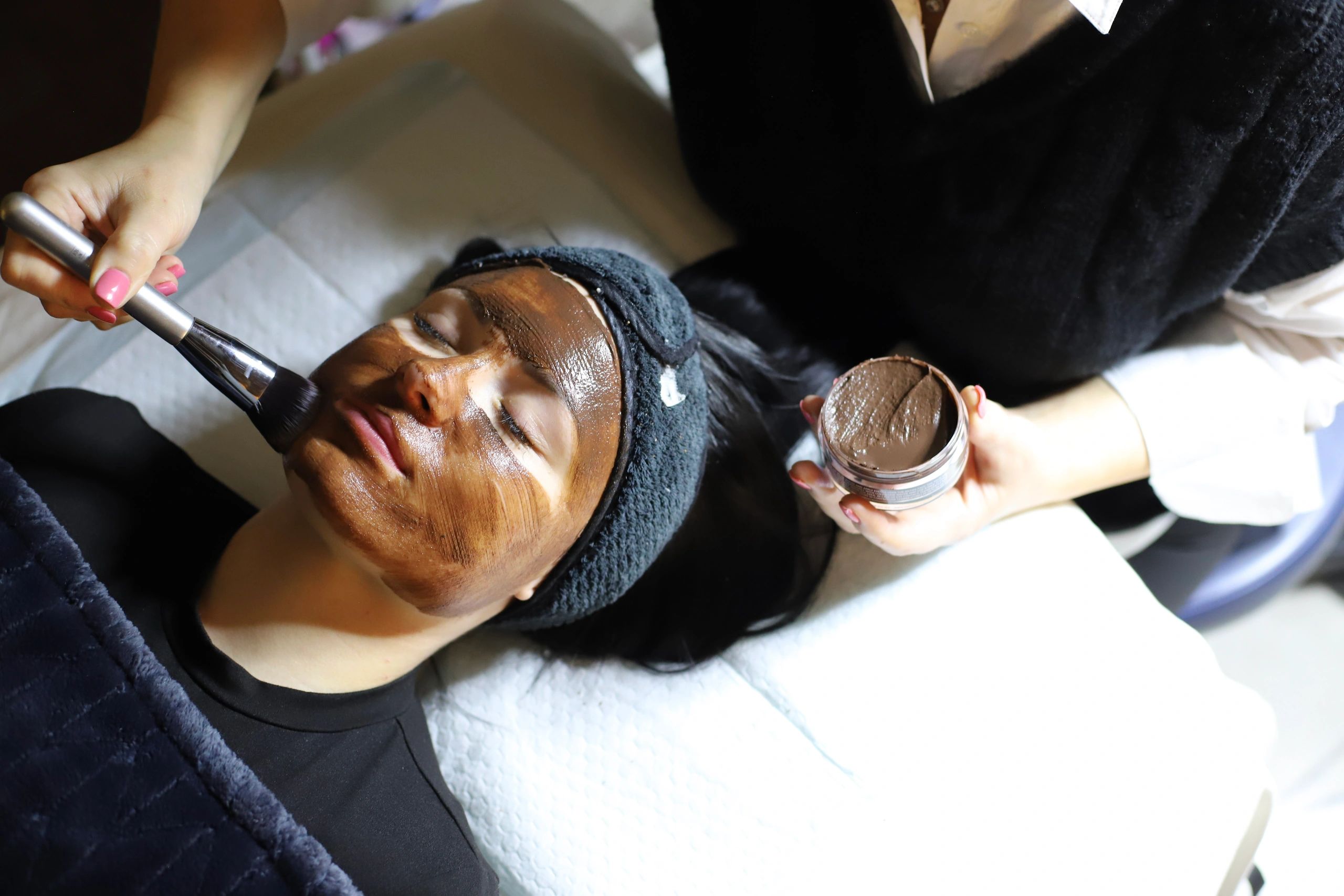 Face mask application with a brush.