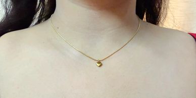 mini heart pendant resembling gold
