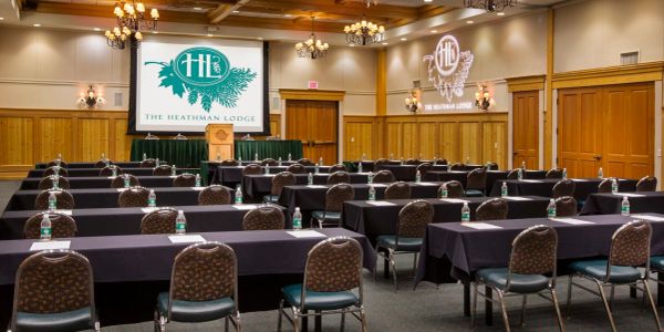 Conference room at The Heathman Lodge with rows of tables and chairs set up for a meeting.