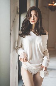 Beautiful Korean girl with long black hair.
She is lifting her dress to show sexy white panties.