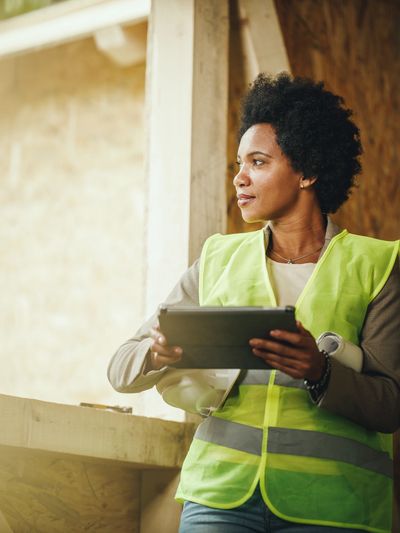 black lady wearing a construction vest