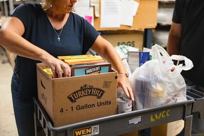 Person boxing up food