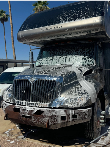 pressure wash foam blast wash of RV camper