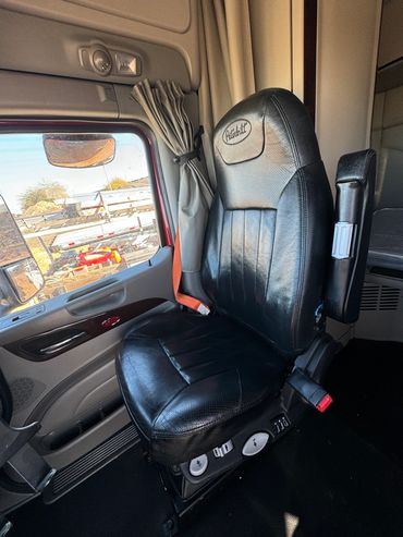 Semi truck leather seat cleaned and detailed