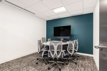 Boardroom renovation with tech features built into the workstations.