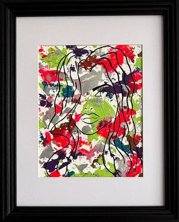 A framed acrylic; partial outline of a woman's face, on neon pink, green, purple, and metallics.