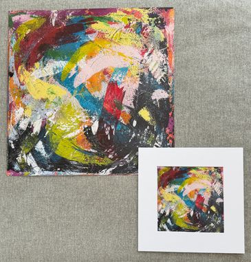 Two prints of the same art; colorful abstract acrylic swishes of pink, black, yellow, blue, red, etc