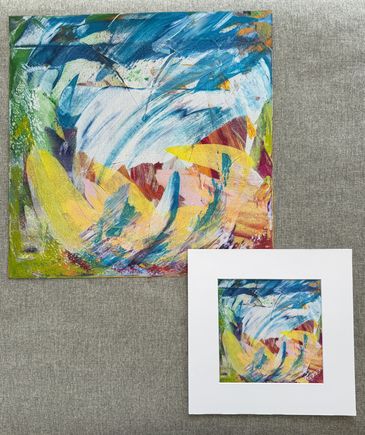 Two prints of same art; colorful abstract acrylic swishes of blue, white, yellow, green, red, etc.