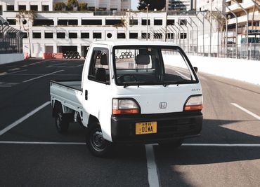 1994 Honda Acty, 5-speed, 2WD with a tri-fold bed, sold by OIWA - reliable Kei Truck choice.