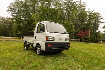 1993 Honda Acty Kei truck in natural setting, a dependable choice from OIWA's selection.