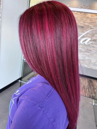 Dimensional vivid red highlight and lowlight. It's color correction, hair is flat ironed and smooth
